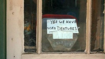 used dentures for sale sign