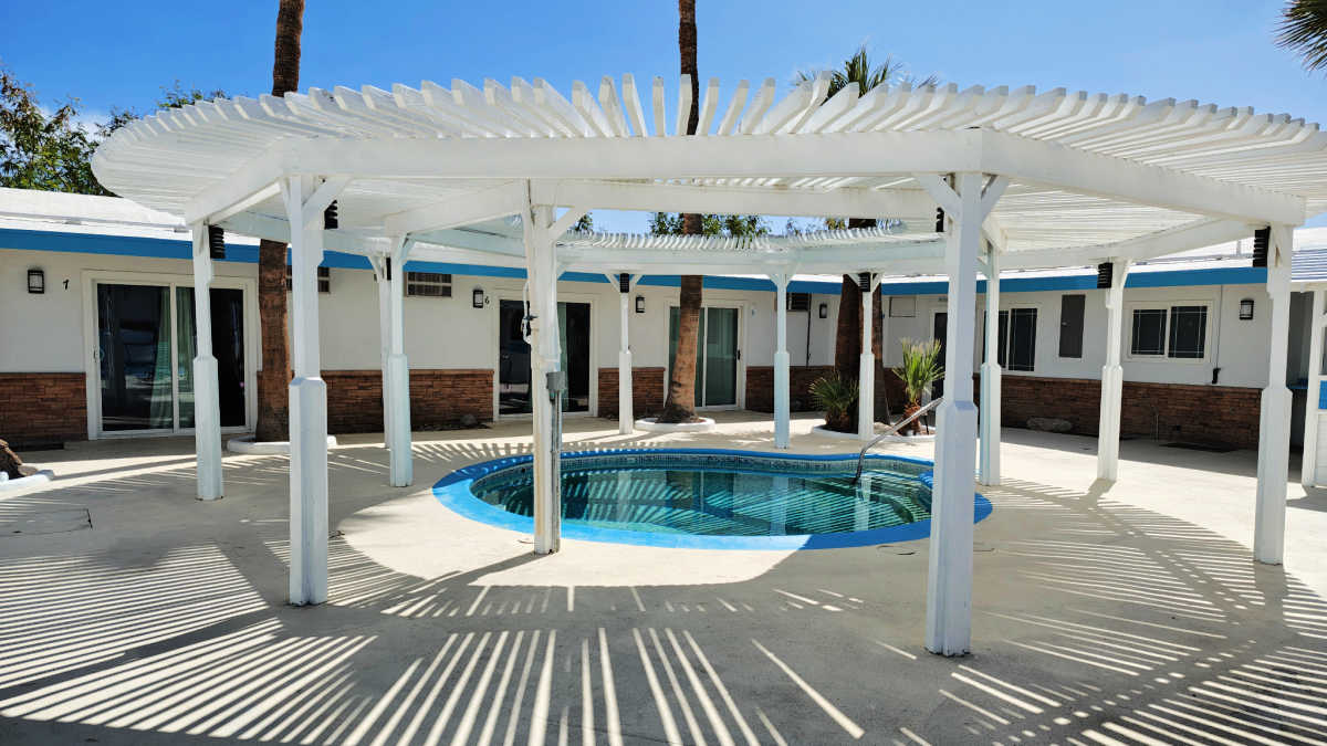 Shallow outdoor pool with partial shade